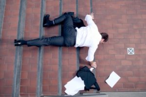 a man lying on the ground after tripping and falling