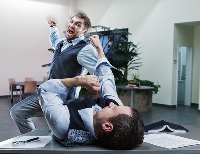 A man committing an assault at work on another man.
