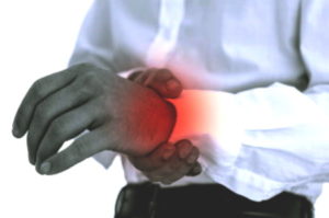 a man holding his wrist after suffering a distal radisu injury