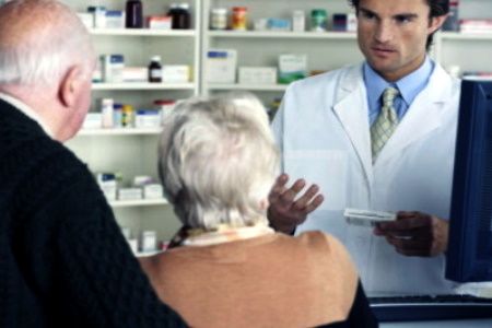 a pharmacist giving some patients medication 
