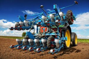 A tractor planting crops. 