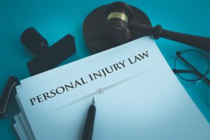 A stack of paper with 'personal injury law' written on the top.