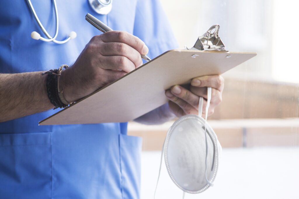 a doctor reviewing a stomach cancer misdiagnosis 