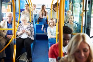 A group of people sitting on a bus