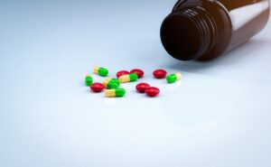 A bottle of pills split on a table. 