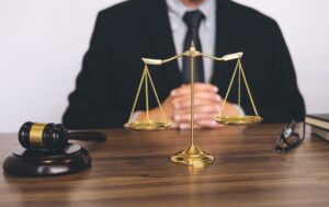 A chest-height image of a solicitor in a black suit. A solicitor can advise on what to do after a cycling accident.