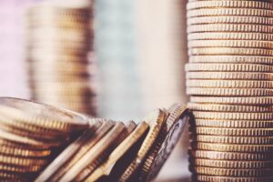 Stacks of coins representing the average payout for an assault at work.