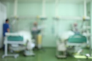A blurry image of a hospital ward.