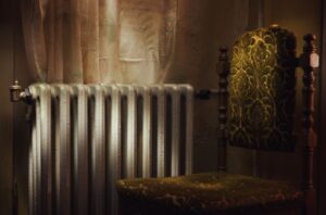 Radiator and chair inside a hotel room