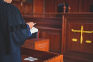 A barrister standing in a court.