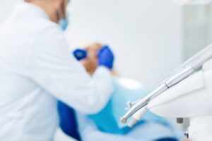A healthcare provider gives care to a patient.