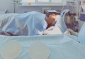 A patient lays in a hospital bed. 