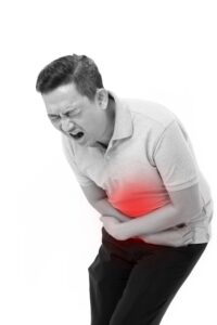 PERSON IN PAIN AFTER SEVERE FOOD POISONING REACTION.