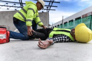 SELF-EMPLOYED WORKER LAYING ON GROUND AFTER AN INJURY AT WORK
