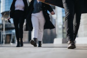 People walking on pavement. 