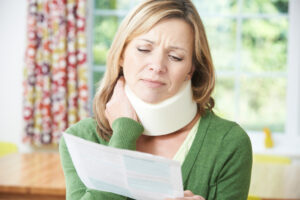 Lady with a neck brace considering a neck injury claim.