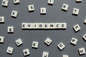 The word evidence spelt out in letter blocks. 