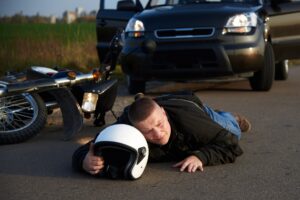 PERSON LAYING INJURED AFTER A ROAD TRAFFIC ACCIDENT