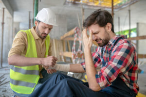 Man with wrist injuries from accident at work.