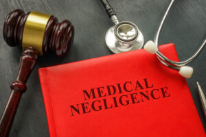 A red book with the title medical negligence that discusses cosmetic surgery negligence