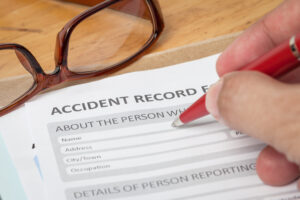 A person completing legal expenses insurance documents as part of their claim