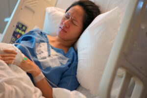 A woman in pain who could make a birth injury claim.
