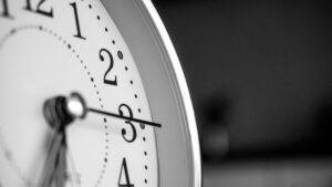A close up image of an analogue clock