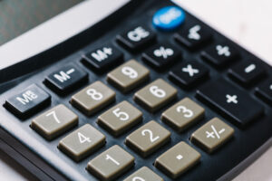 A black compensation calculator on a white background