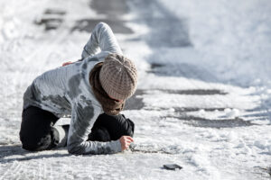 Woman injured on the floor after she slipped on ice at work