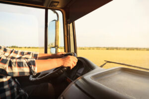 A delivery driver driving a van.