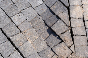 A birds-eye shot of broken pavement slabs.