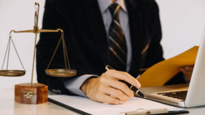 A solicitor working on a spine injury claim in their office